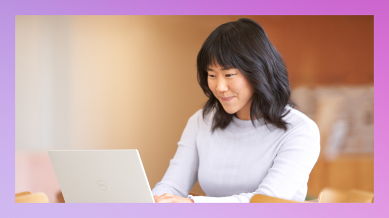 Photo of a woman working at a laptop