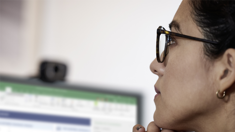 Woman looking at Excel screen