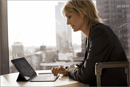 Business woman in remote office working on laptop