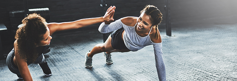 Image of two women exercising together