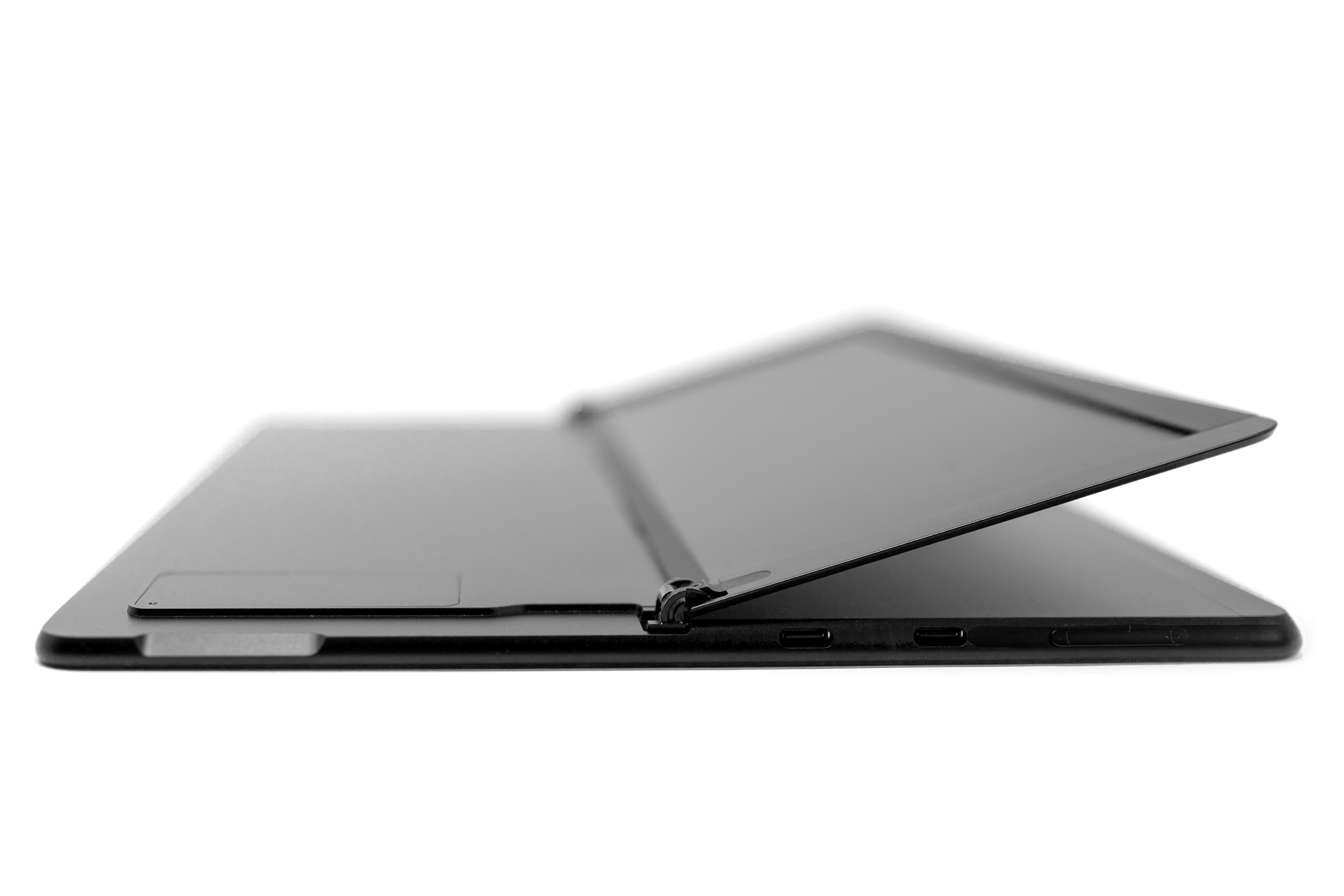 A Surface Pro X with the kickstand lifted to reveal a SIM door.