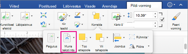 Teksti mähkimise viisi valimiseks pildi või joonistusobjekti ümber klõpsake nuppu Murra teksti ridu.