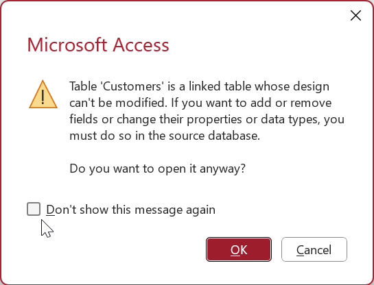 Access'te bağlantılı tabloyu Tasarım görünümünde açmayla ilgili uyarı iletisi. Bu iletiyi bir daha gösterme etiketli bir onay kutusu seçiliyor.