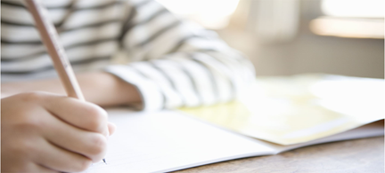 Chid with book and pencil